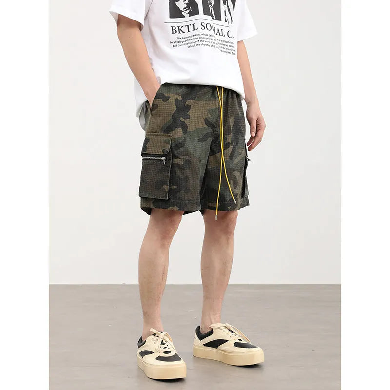 Men's camouflage work shorts with multiple pockets, cropped length and mid waist design