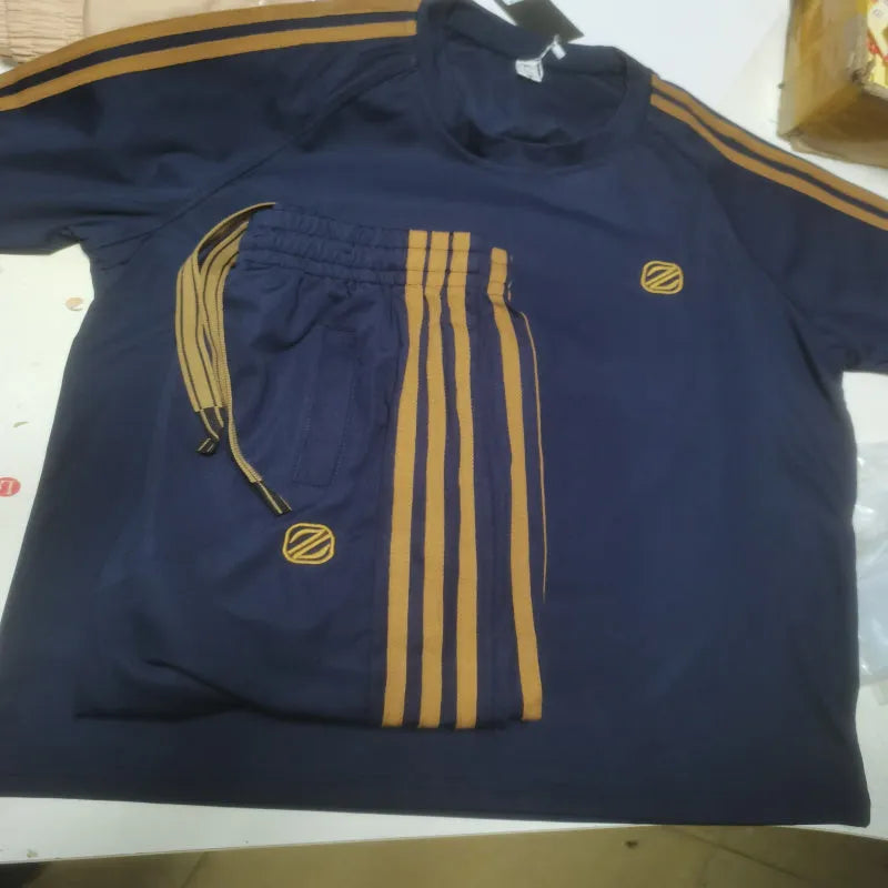 Men's blue short sleeve polyester sport suit set with matching trousers