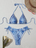 Women's denim blue printed bikini set with strap detail, made from nylon spandex fabric.