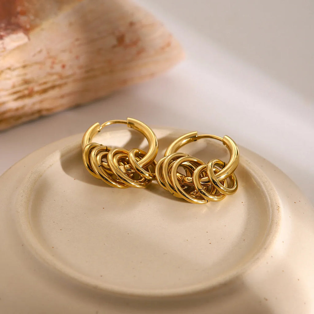 Pair of stainless steel ins style earrings with an electroplated silver-toned finish.