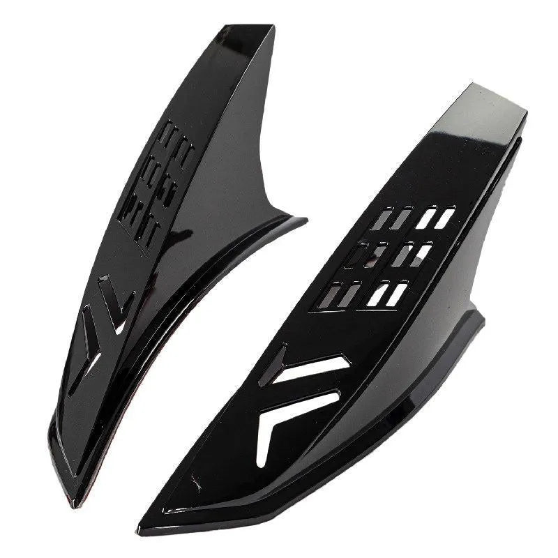 A pair of black plastic decorative horns for children's helmets with visible 3M adhesive backing.