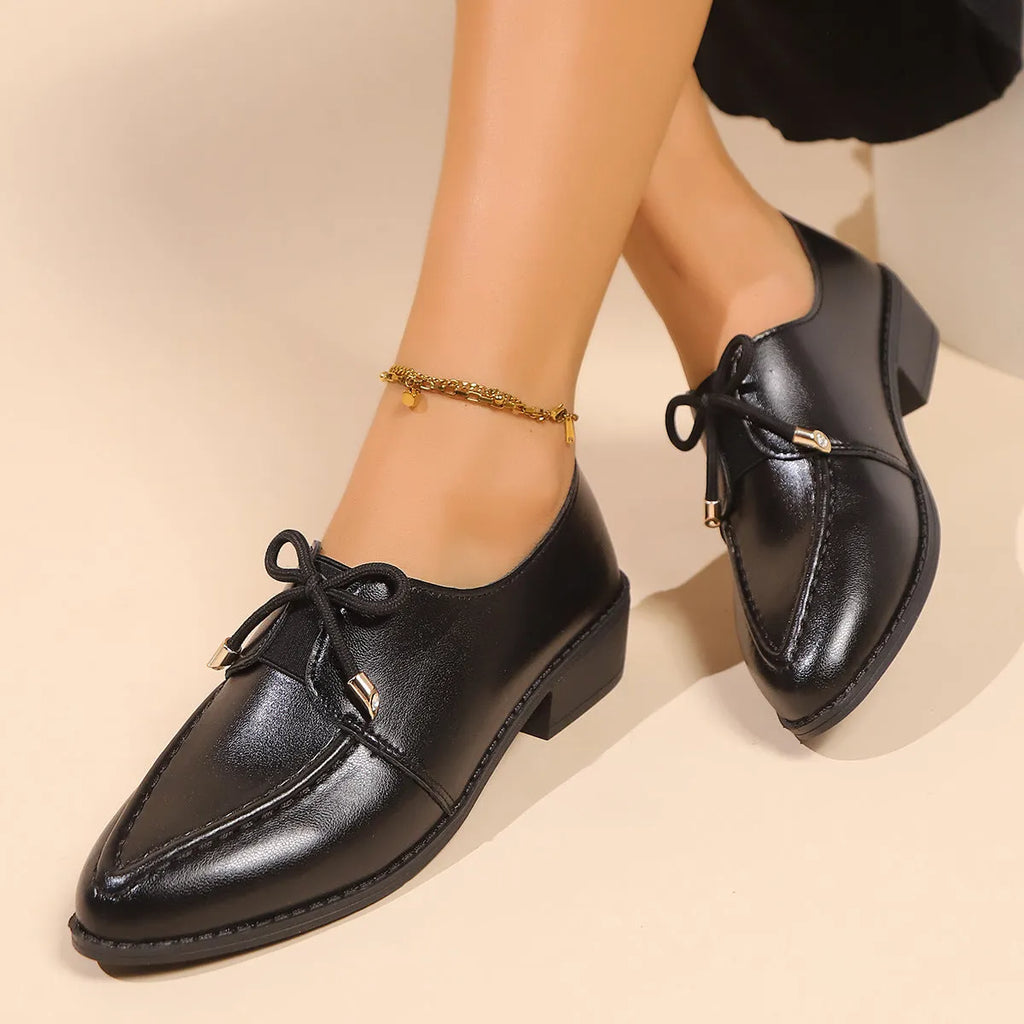 Women's simple leather shoes with a pointed toe and a choice of big bow or small bowknot detail.