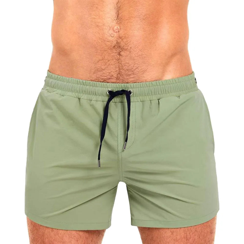 Polyester mesh-lined sports shorts in solid colours for swimming and fitness.