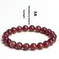 Natural cherry red strawberry quartz bracelet with geometric beads showing starlight effect