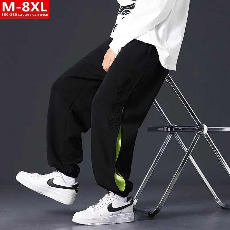 Men's loose cotton trousers with stitching detailing and ankle banding in grey green colour