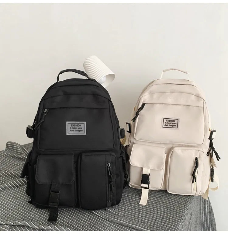 Soft nylon student backpack in black with three-dimensional pockets and laptop compartment