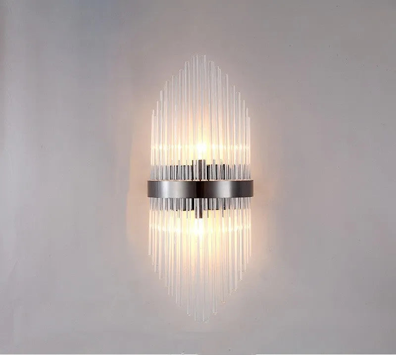Modern crystal wall lamp with petal design and titanium gold finish mounted on wall