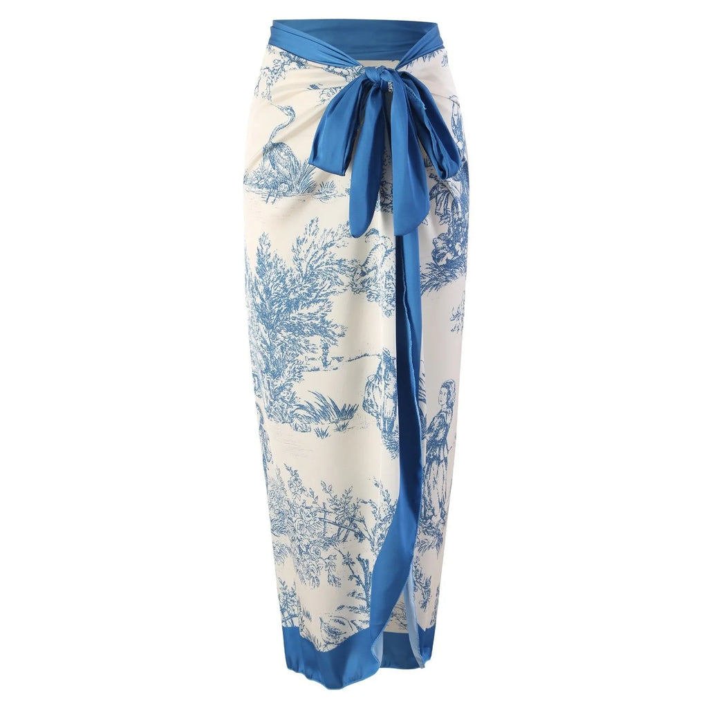 Blue women's one-piece swimsuit with matching gauze skirt set on hanger