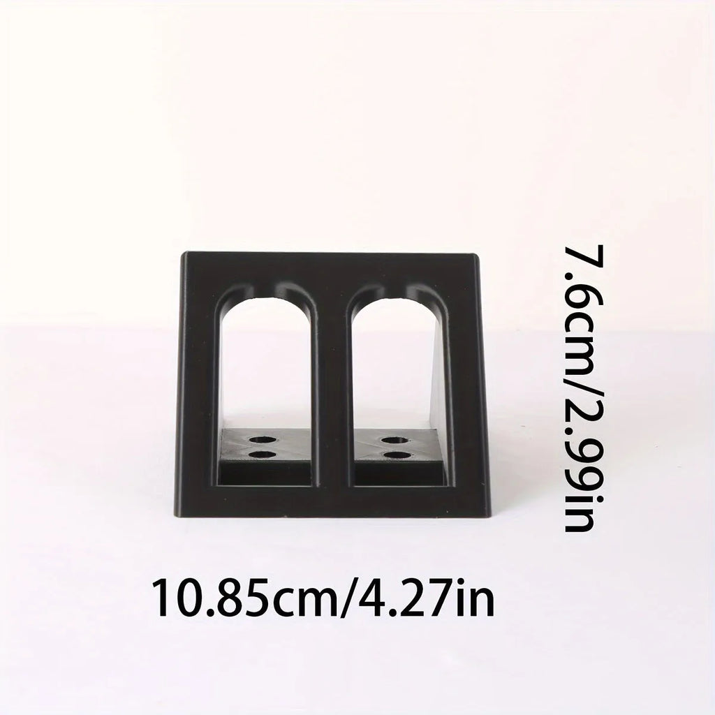 Black punk-style plastic pistol stand for displaying an airsoft gun.