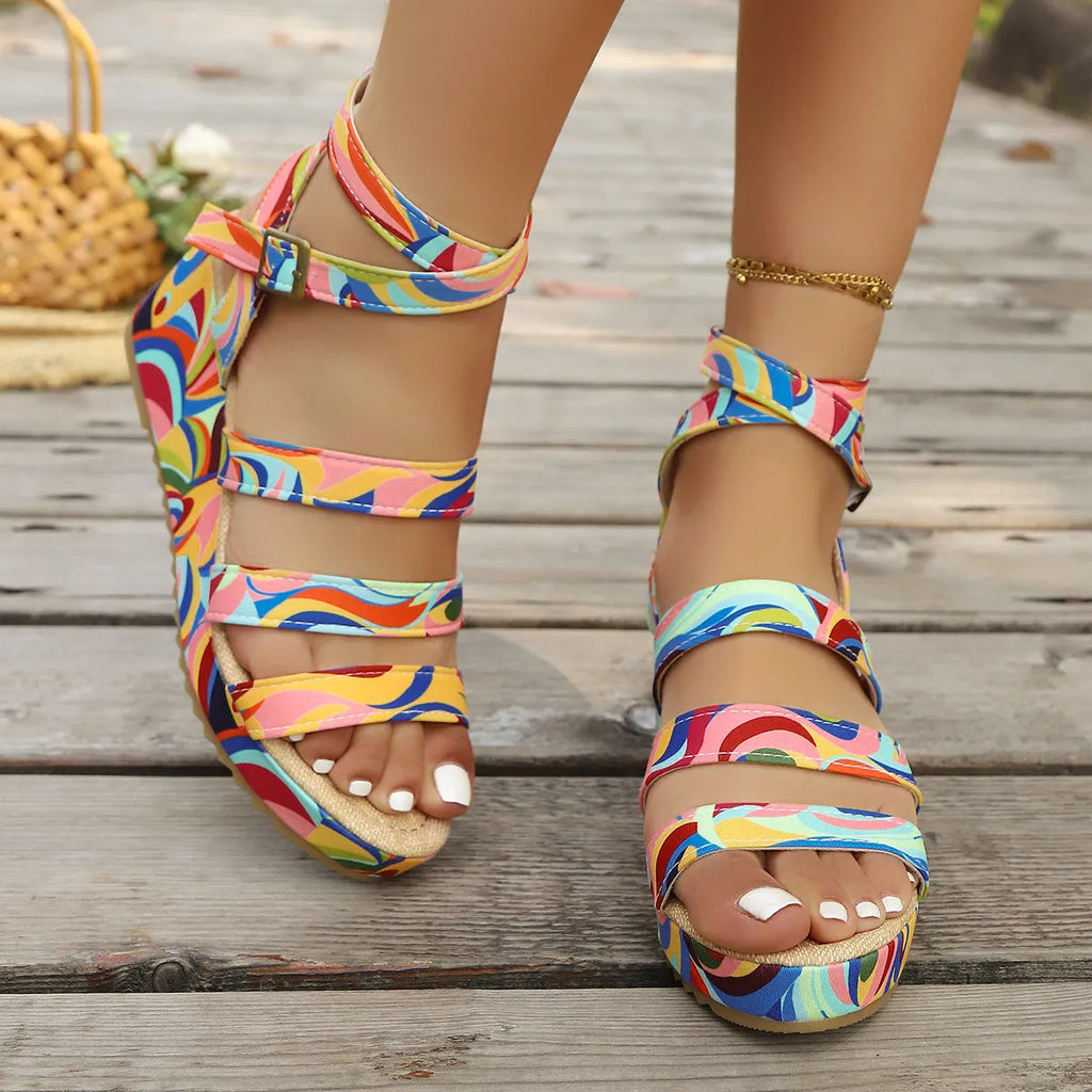 Women's wedge sandals with buckle strap showing fish mouth toe design in single colour