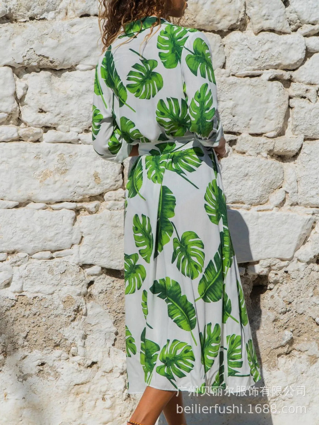 Women's printed chiffon V-neck dress with high waist and A-line skirt on a hanger.