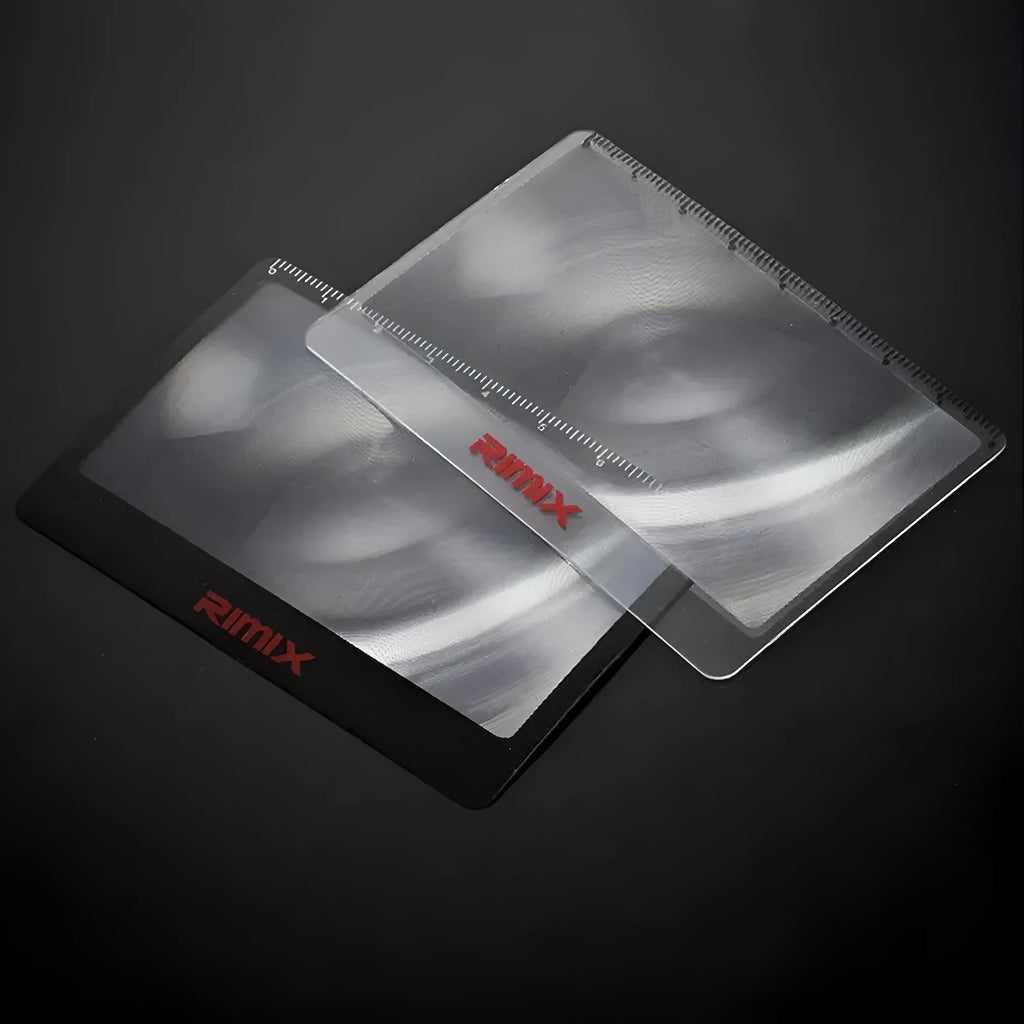 Black and white portable credit card sized foldable plastic magnifier for reading small text.