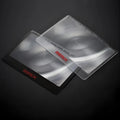 Black and white portable credit card sized foldable plastic magnifier for reading small text.