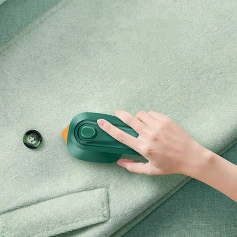 Dark green portable hanging steam ironing machine with ceramic panel and compact design.