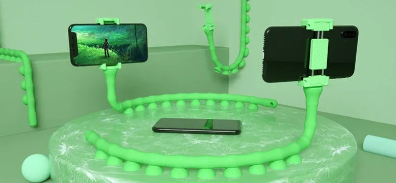 Black flexible rubber phone holder with suction cup extended to 62cm length on a desktop