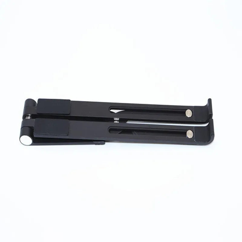 Black aluminium adjustable notebook stand for laptops on a desk.