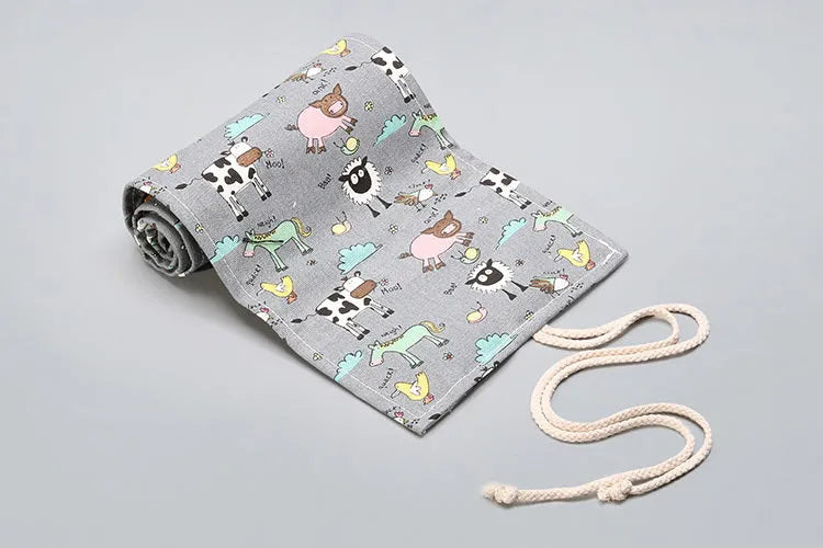 Rolled canvas pencil wrap with elastic bands holding coloured pencils, in 48-slot configuration