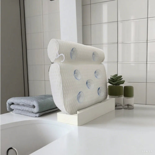 White bathtub pillow with 4D mesh and 7 suction cups on a bathtub.