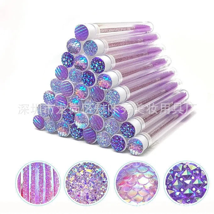 Set of coloured disposable mascara brushes inside clear plastic storage tubes on a white background.