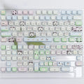 Full set of colourful anime puppy design PBT keycaps for a mechanical keyboard on a white background.