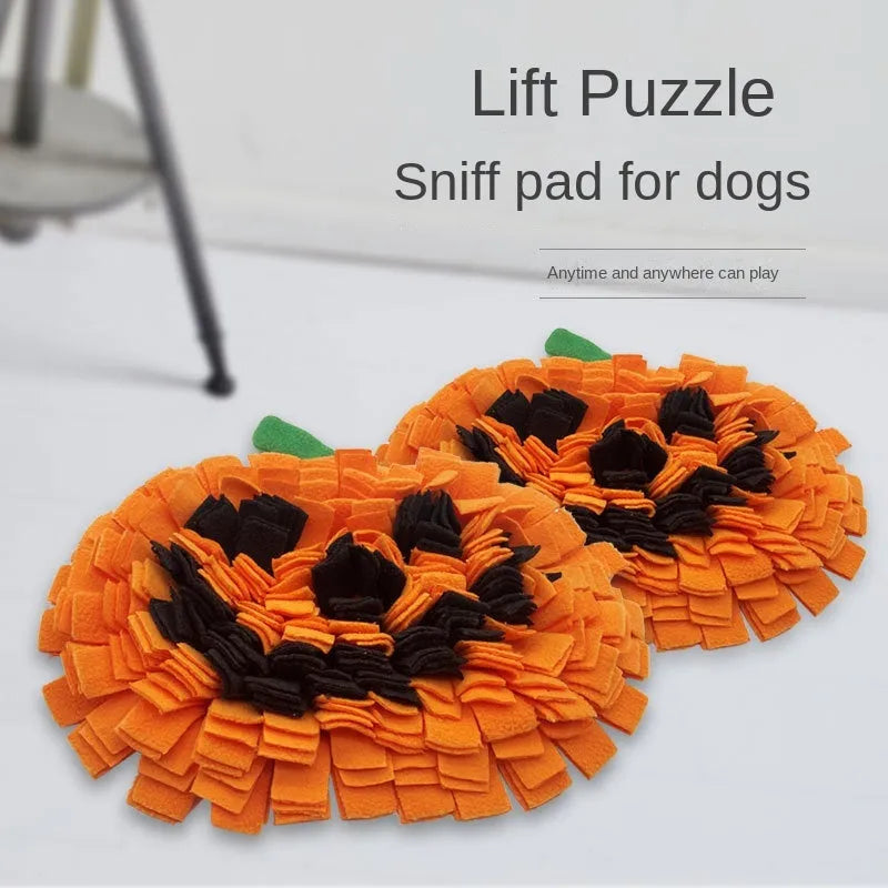 Orange pumpkin-shaped dog sniffing mat with raised fur textures for slow feeding and treat hiding.