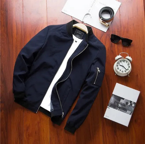 Men's slim-fit casual baseball jacket with zippered side pockets in a solid colour.
