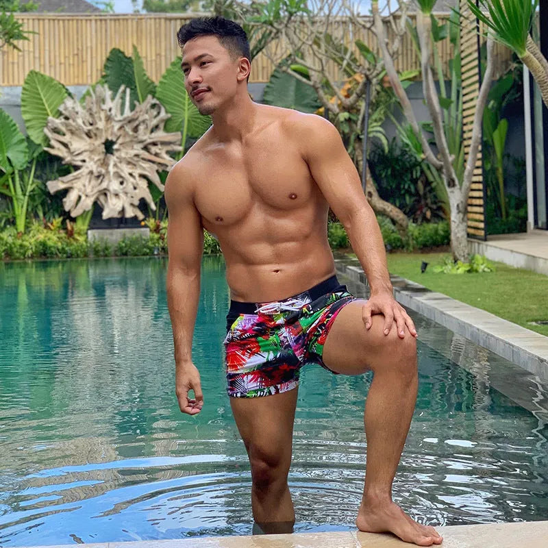 Men's spandex polyester swim shorts with elastic waistband in picture colour, available in sizes S to XXL