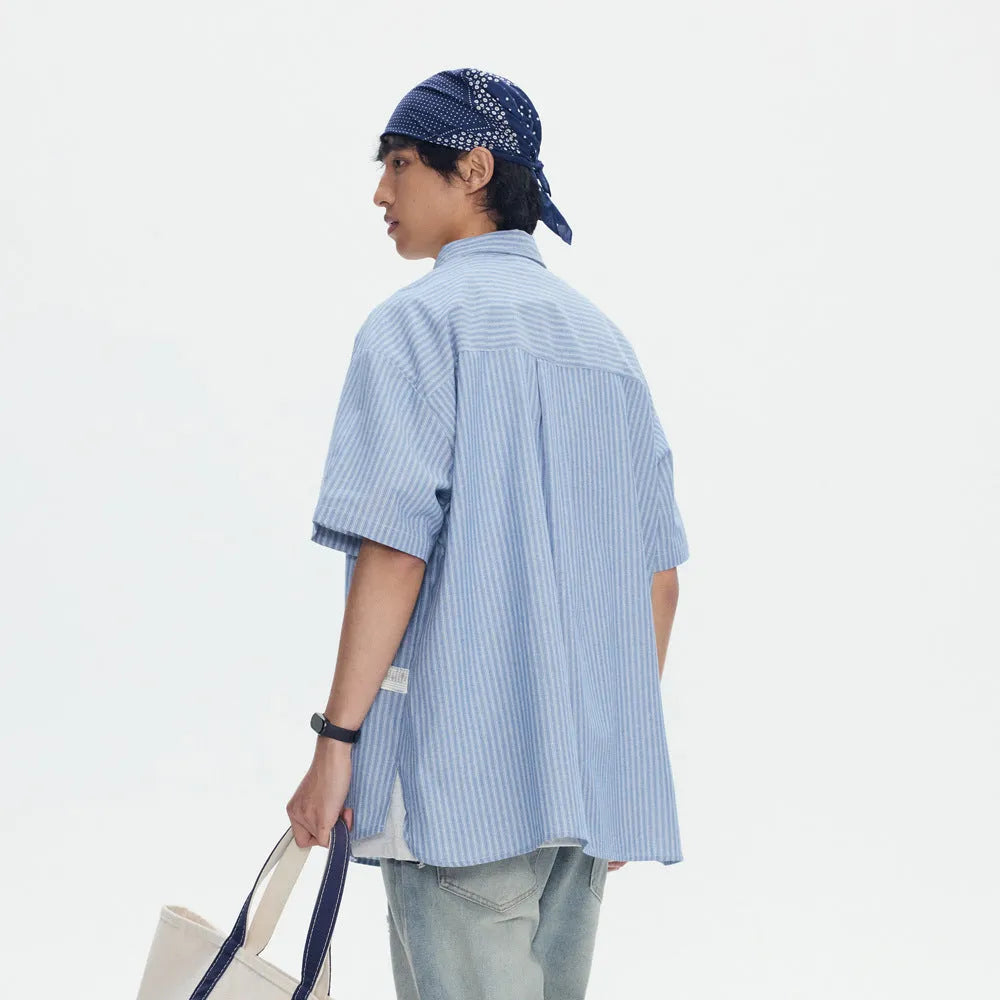 Blue striped loose fit overalls shirt with short sleeves and cardigan style design