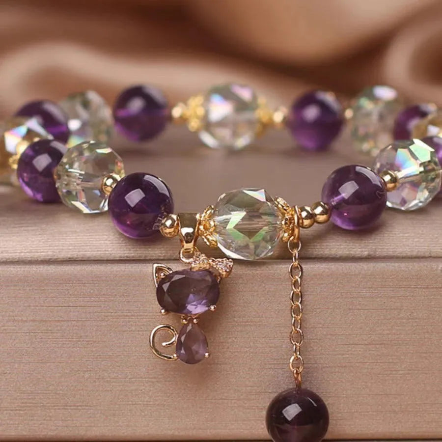 Women's antique-style crystal bracelet with a nine-tailed fox pendant and a separate amethyst floral charm.
