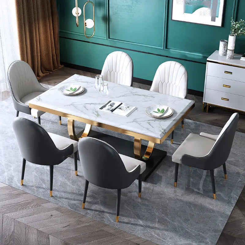 Rectangle slate dining table with marble finish and metal frame, shown with pineapple or round-back chairs