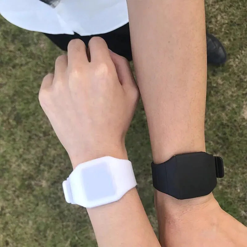 Square electronic touch screen watch with digital display on a PU strap, shown in multiple colour options.