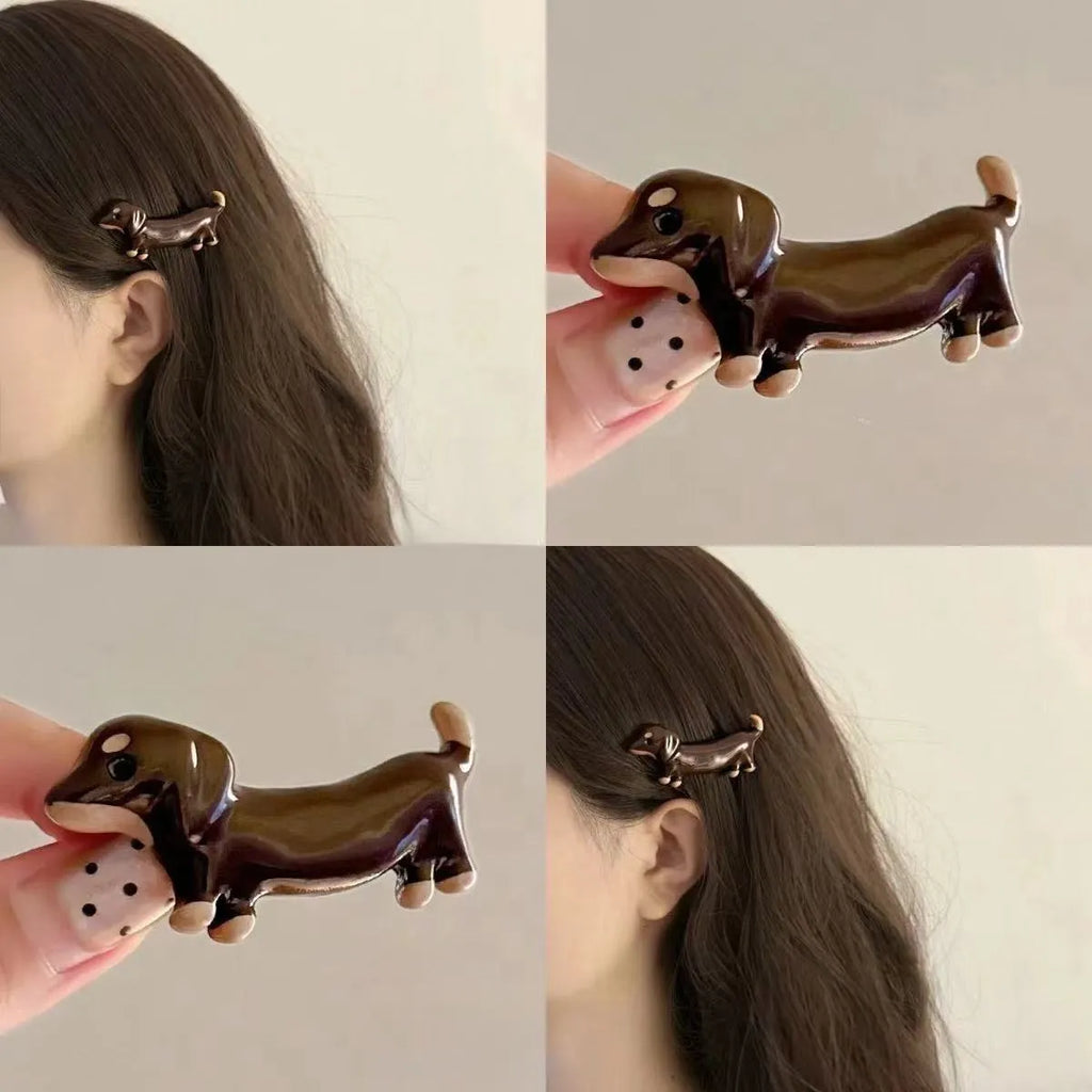 Dachshund dog shaped hair barrettes with electroplated finish, shown as a single clip or a pair.