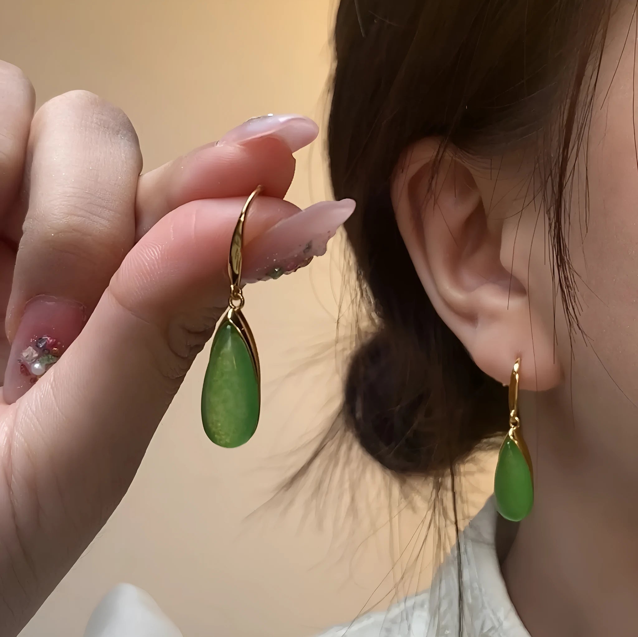 Chinese style geometric earrings with jade colour finish and water droplet design elements