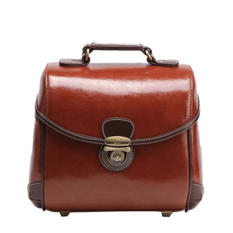 Single shoulder SLR camera liner bag in PU leather with polyester cotton insert, shown in reddish brown