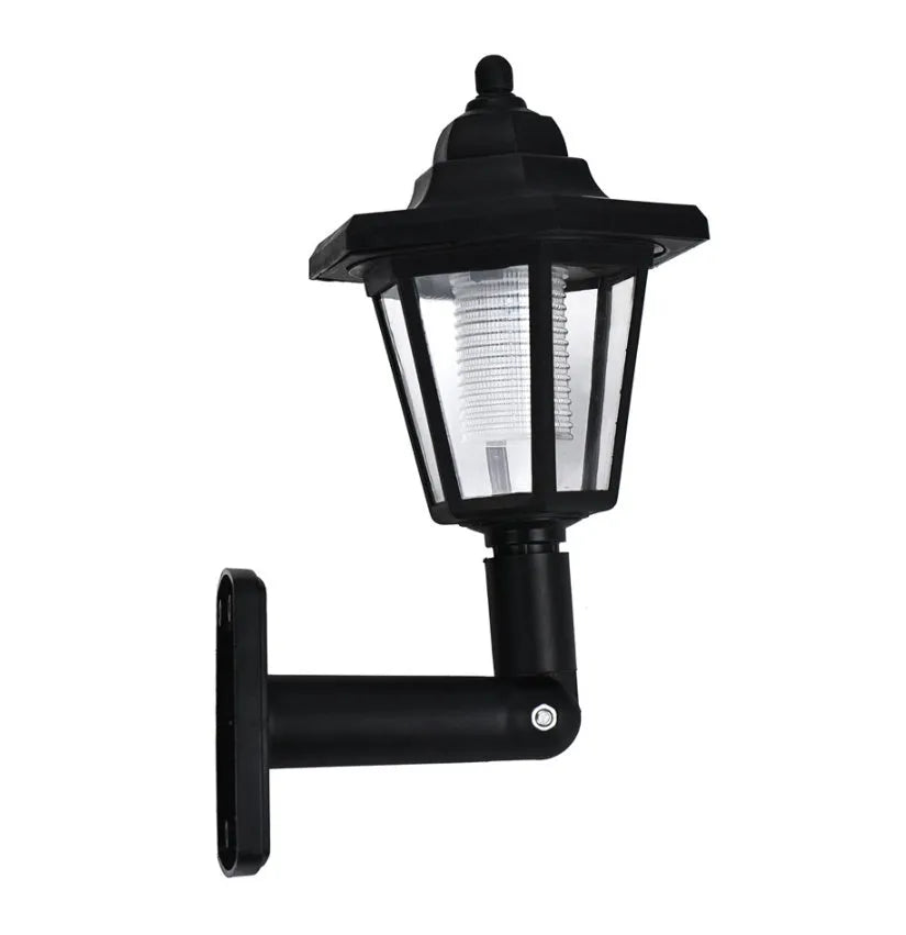 Black hexagonal solar-powered wall light with LED and solar panel for outdoor use