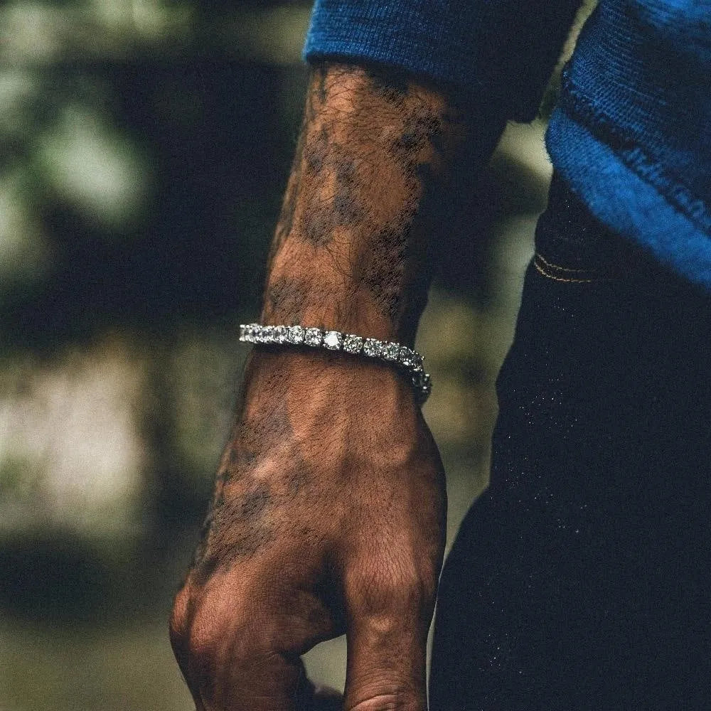 Men's silver geometric link chain hip hop bracelet with a row of clear rhinestones.