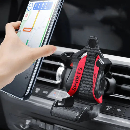 Gold coloured car air vent mobile phone holder with 360-degree rotating head mounted on a car dashboard vent.