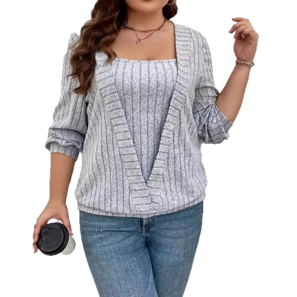 Women's solid colour rib-knit V-neck tunic with a false two-piece skirt design, shown in a loose fit.