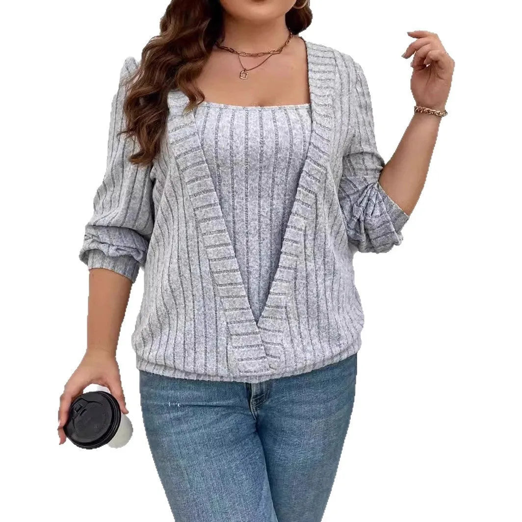 Women's solid colour rib-knit V-neck tunic with a false two-piece skirt design, shown in a loose fit.