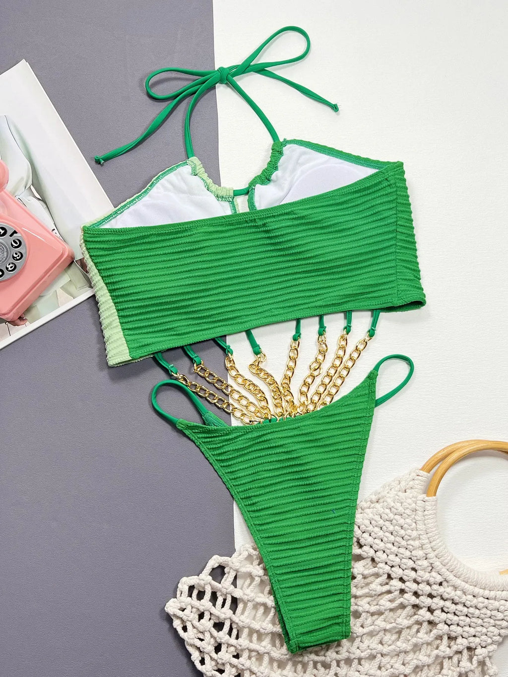 Green women's one-piece swimsuit with hollow back design