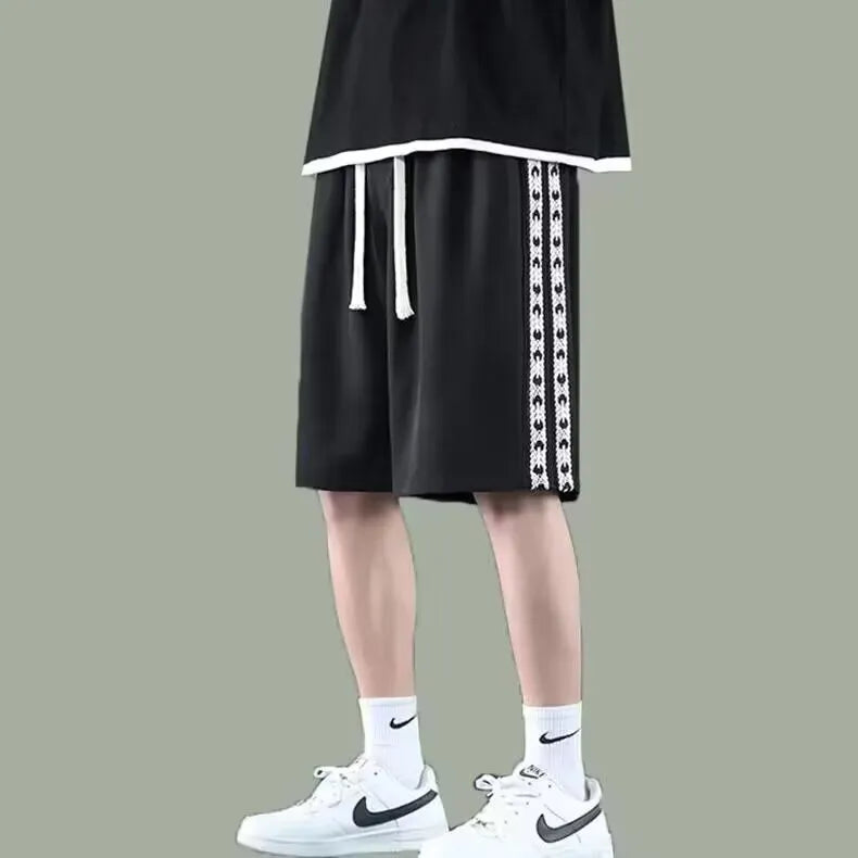 Men's loose fit baggy track pants in black, light grey, and dark grey colours with micro elastic fabric
