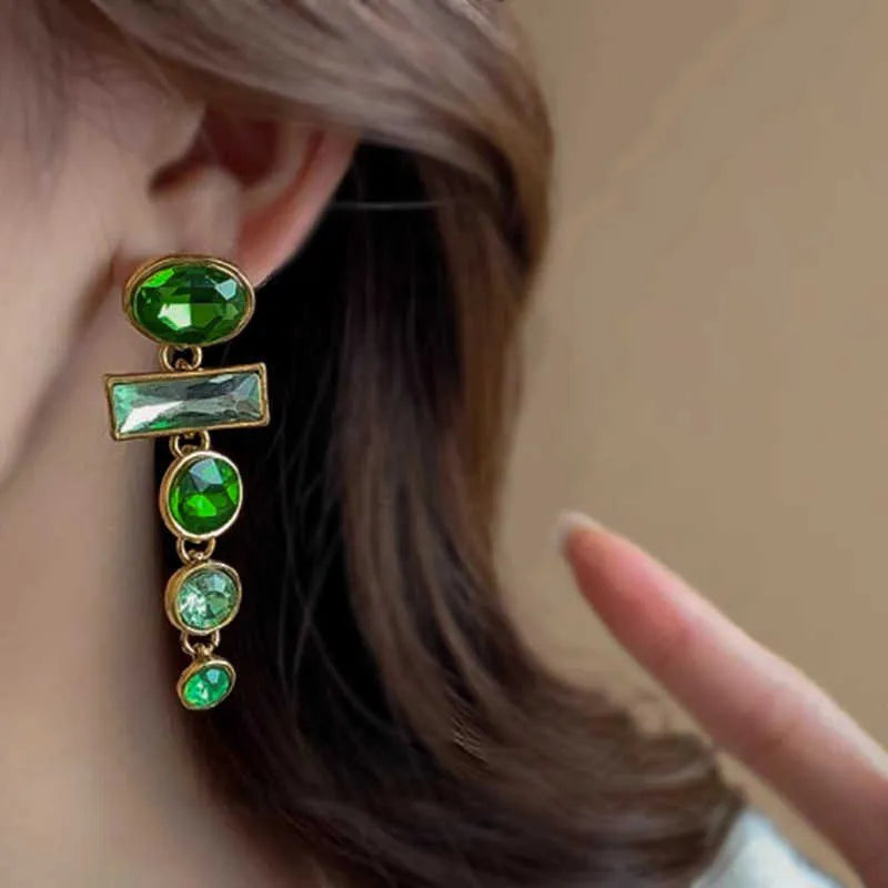 Green gradient tassel dangle earrings with geometric metal frame and sparkling zircon stones.