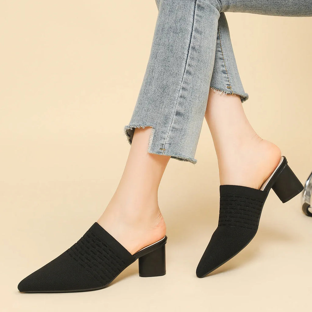 Women's black pointed toe sandals with decorative toe cap and 5cm chunky heel on a white background.