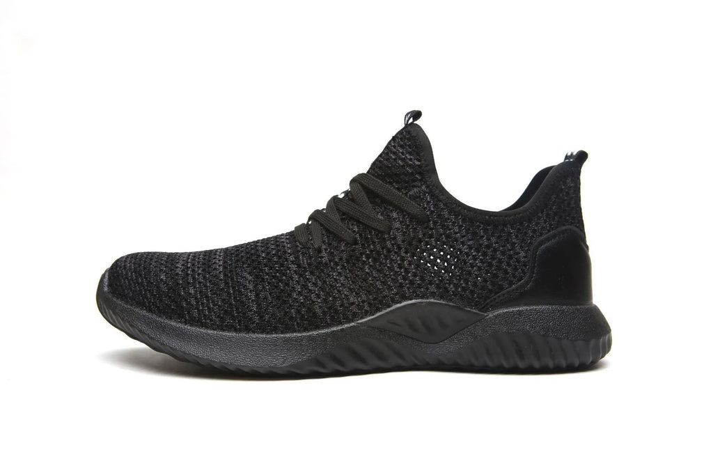 Low-cut black safety work shoes with a steel toe cap on a grey background.