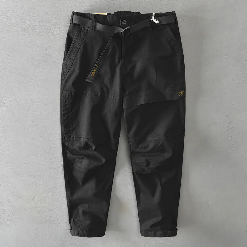 Man wearing khaki cotton elastic casual Japanese overalls with a loose fit.