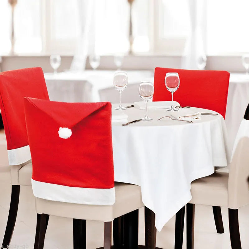 Set of Christmas chair covers featuring Santa Claus, Snowman and Santa hat designs on dining chairs