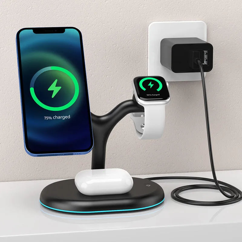 Black magnetic wireless charging stand holding a phone upright on a desk.