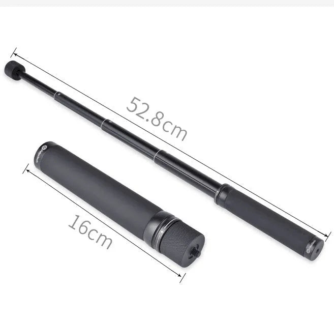 Black retractable selfie stick with extended aluminium pole and Bluetooth remote, holding a smartphone.
