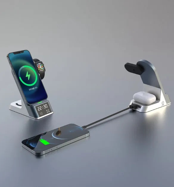 Black six-in-one wireless charging alarm clock with colour display on a nightstand.