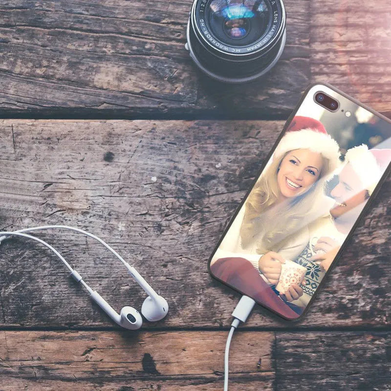Patterned ultra-thin iPhone case with raised camera bumper edge on a table.